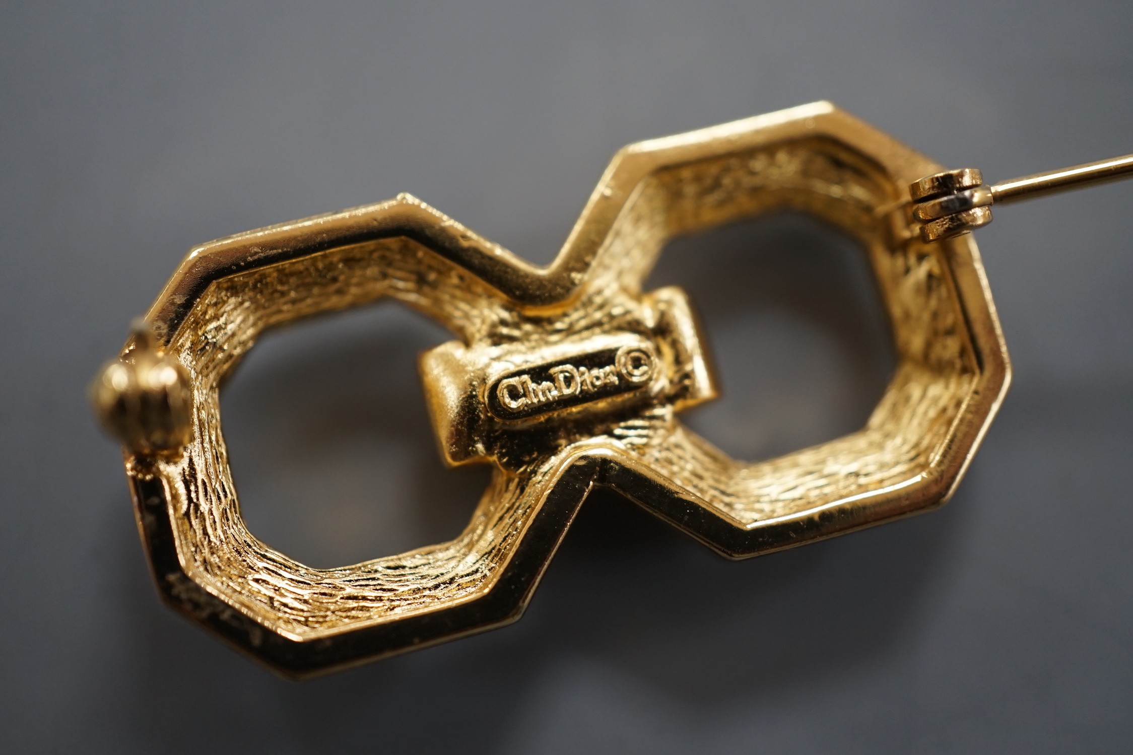 A Christian Dior gilt metal and paste set costume set double octagon brooch, 34mm.